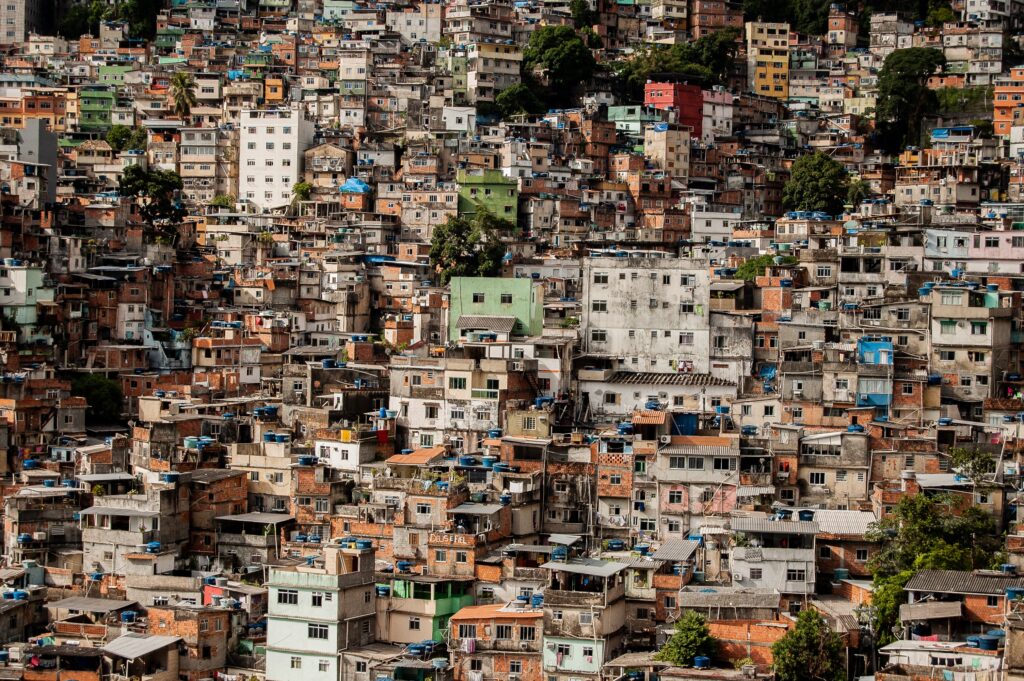 Aerial shot of small building near to each other on a hill